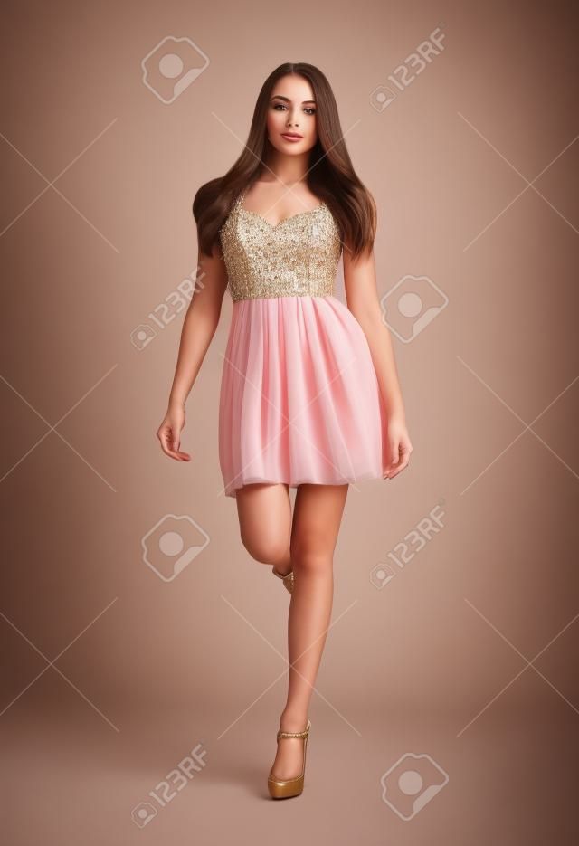 Young brunette lady in gorgeous dress  Fashion