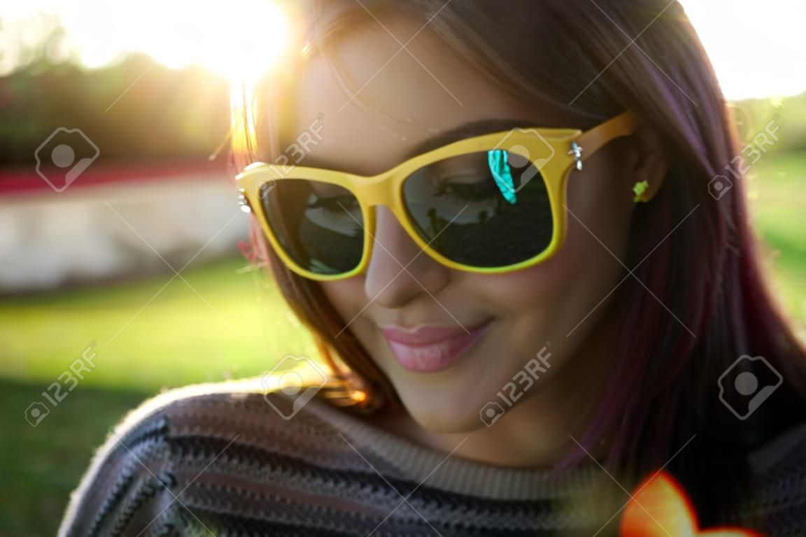 Closeup portrait of a smiling fashionable woman