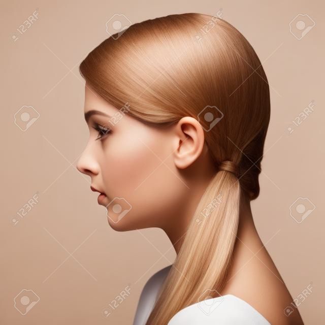Side view portrait of a beautiful woman with clean face