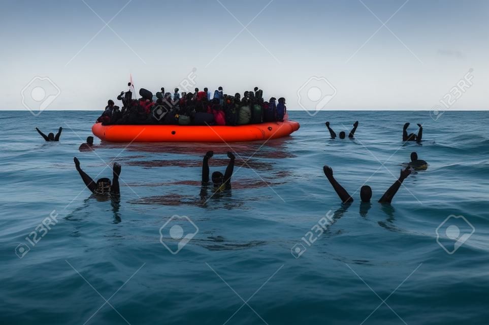 Refugees on a rubber boat in the middle of the sea that require help. Sea with people asking for help. Migrants crossing the sea