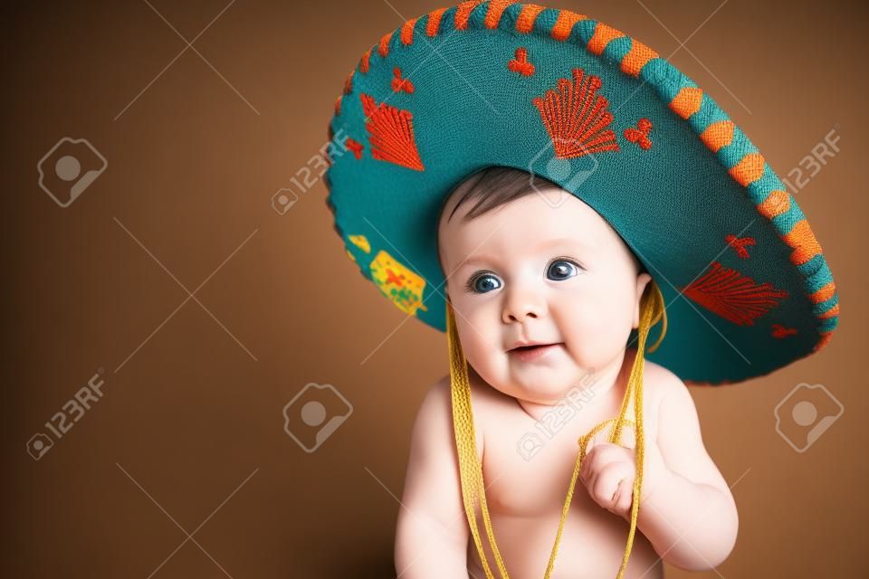 6 month old baby boy wearing a Mexican hat