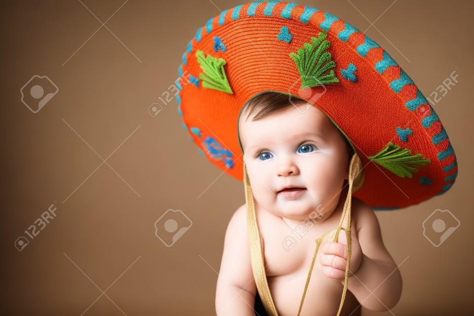 6 month old baby boy wearing a Mexican hat