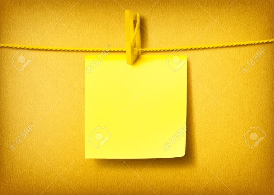 Yellow paper sticky note hanging on a rope with a clothespin. Template isolated on a transparent background. Vector background with copy space