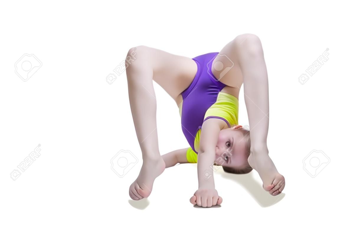 Cute young girl doing gymnastics isolated over white