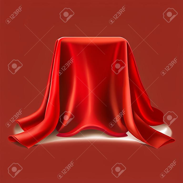realistische Box mit rotem Seidentuch auf weißem Hintergrund bedeckt. Leeres Podium, Stand mit Tischdecke, um Zaubertricks zu zeigen. Geheimes Geschenk, versteckt unter Satinstoff mit Drapierung und Falten