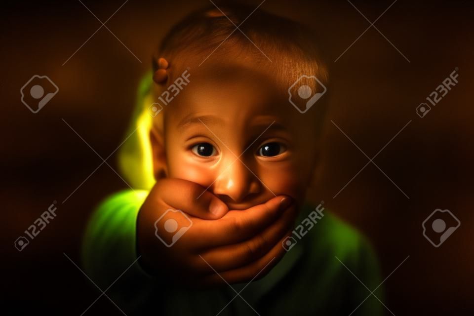 child being abducted over dark background