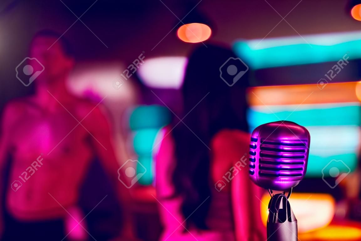 microphone on a stand up comedy stage with reflectors ray, high contrast image