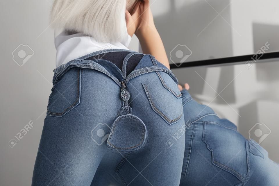 female priest. jeans that fastened back