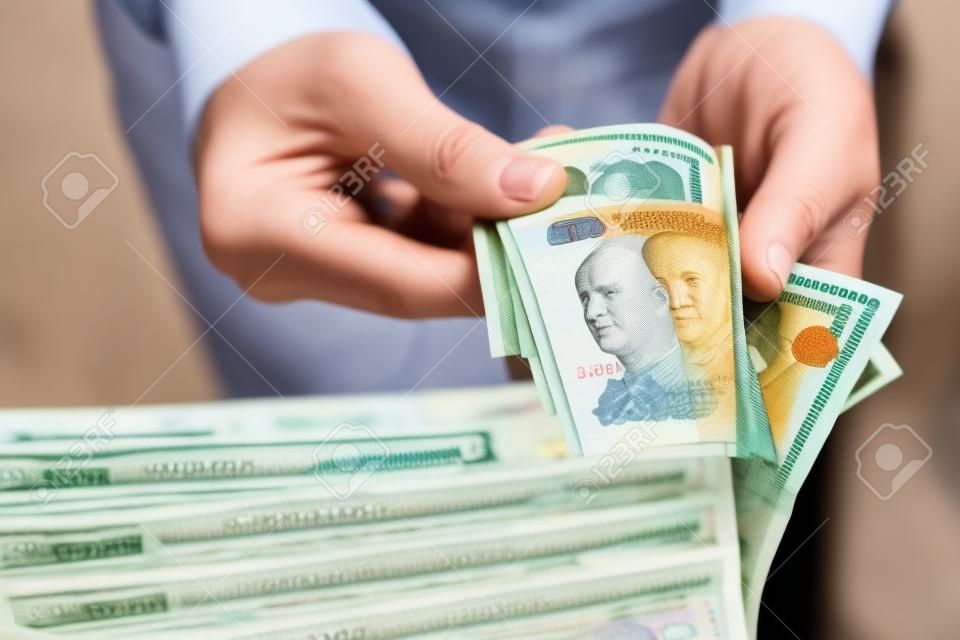 Russian rubles in the hand of a fan.male hand holding many of the Russian banknotes.The transfer of money.The isolated five-thousandth of Russian rubles denominations in a hand.