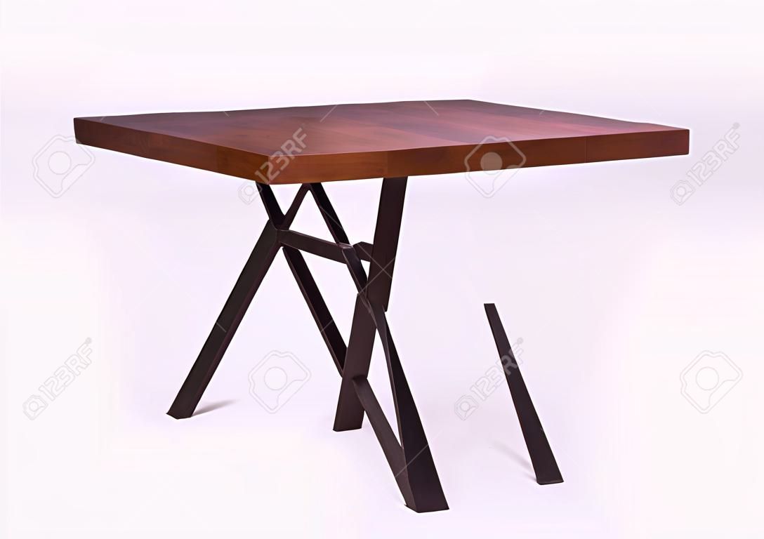 wooden lacquered table with black metal legs on white background standing at an angle of 45 degrees