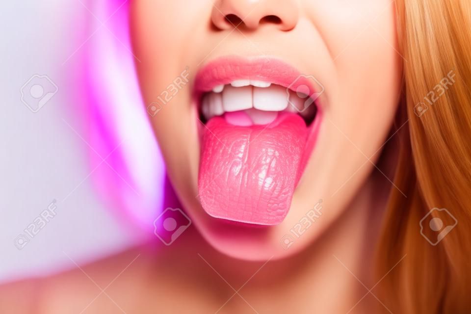 Front view of a woman tongue. Close up.