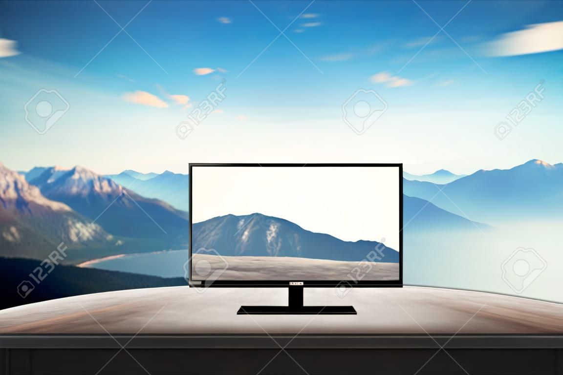 isolated tv on desk with mountain nature background for mock up presentation