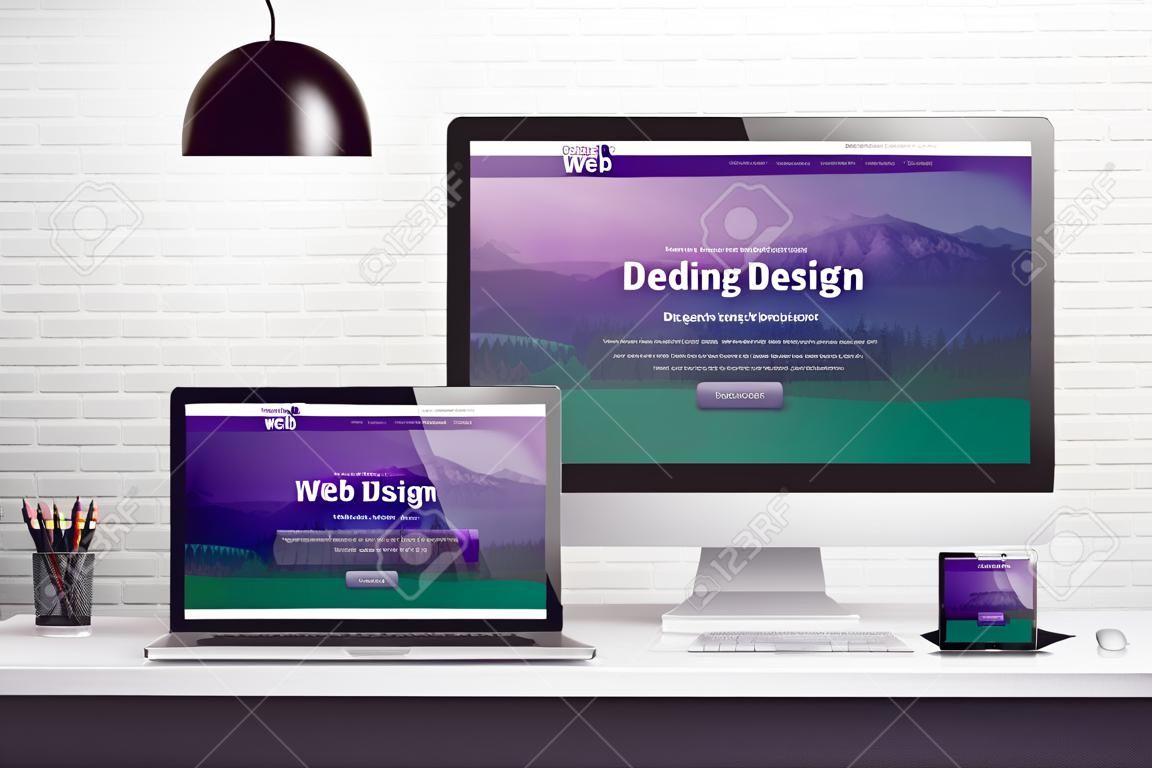Responsive web site on multiple different display devices. Concept of web design, development work desk.