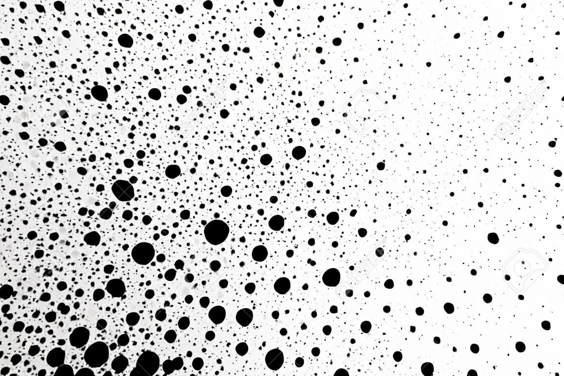 Black spray paint dots make a very fine grungy background.
