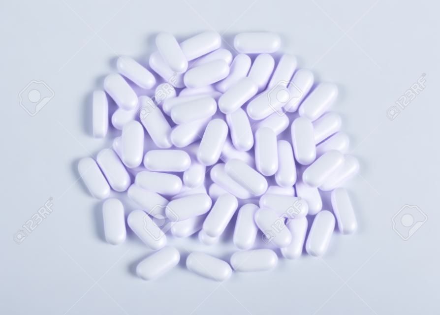 heap of BCA pills isolated on white