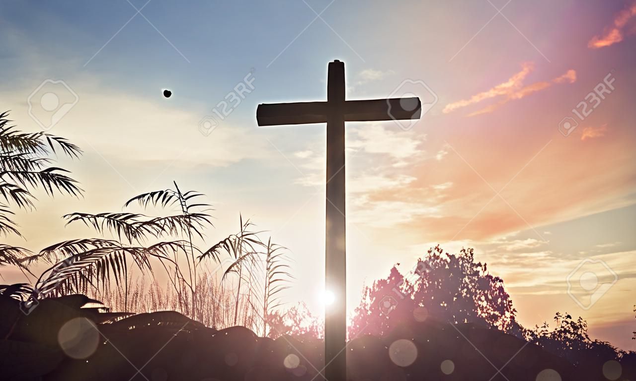 Religious cross over the sunset