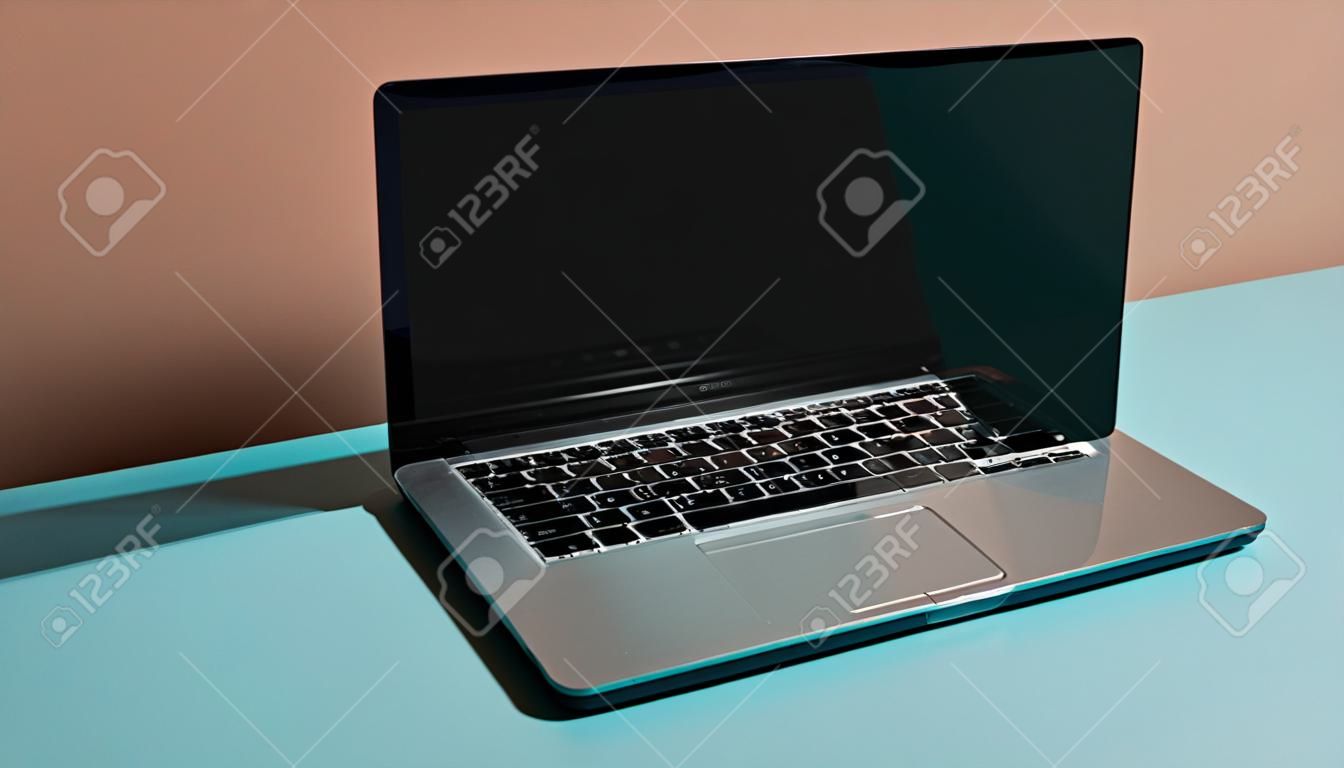 Laptop with blank screen on blue and orange background. 3d rendering