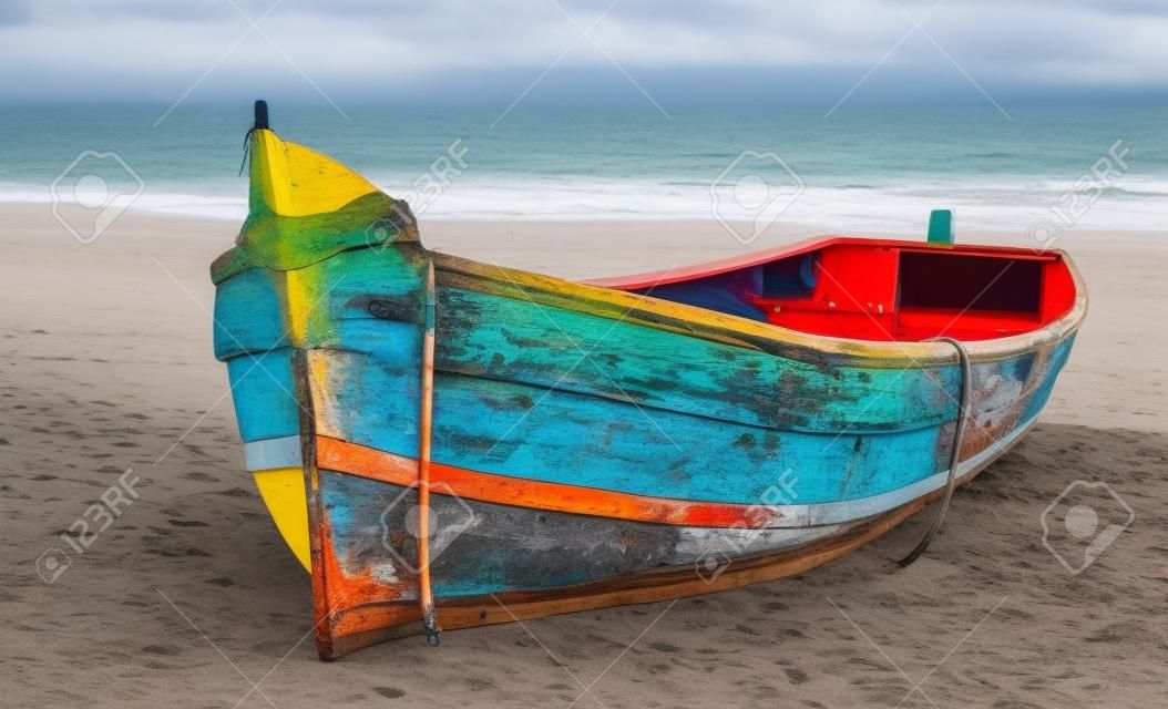 Beautiful and colorful small Fishing Canoe beached up on coastal island. This fishing canoe is generator powered and is used for fishing in high seas, and in offseason, to transport and ferry tourists