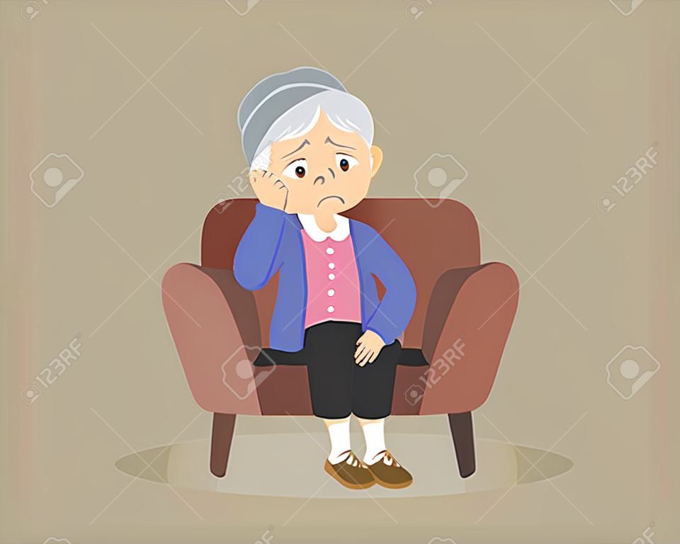 smutna starsza kobieta Znudzona, starsza kobieta siedzi samotnie na kanapie