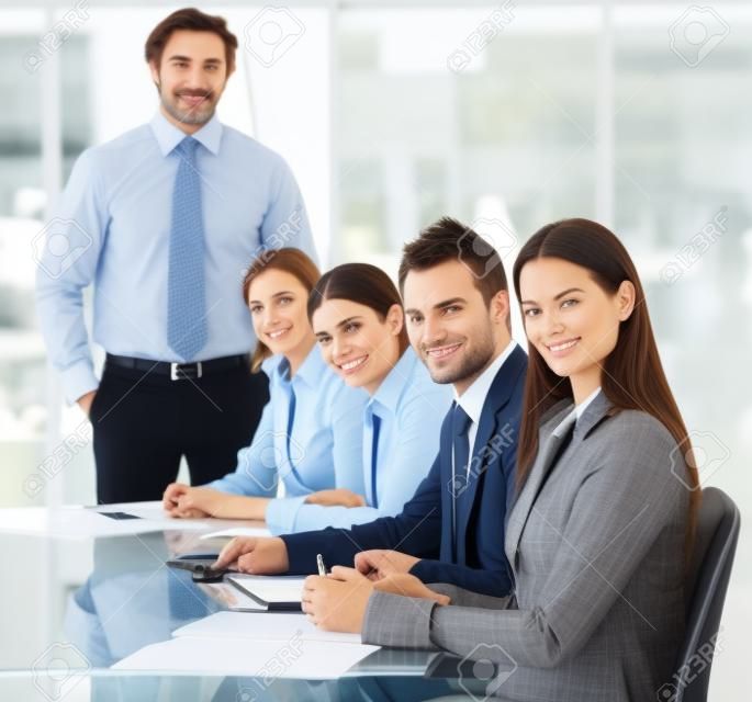 Business people looking at the camera in a meeting