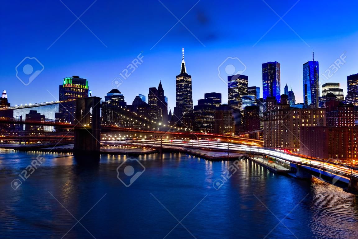 Brooklyn Bridge in Manhattan downtown with Cityscape at sunset New York USA