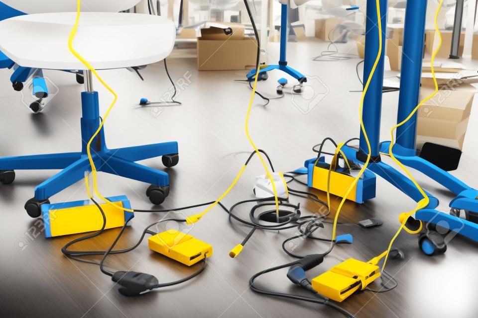 Concept of clutter in office. Unwound and tangled electrical wires under the table. 5S system of lean manufacturing