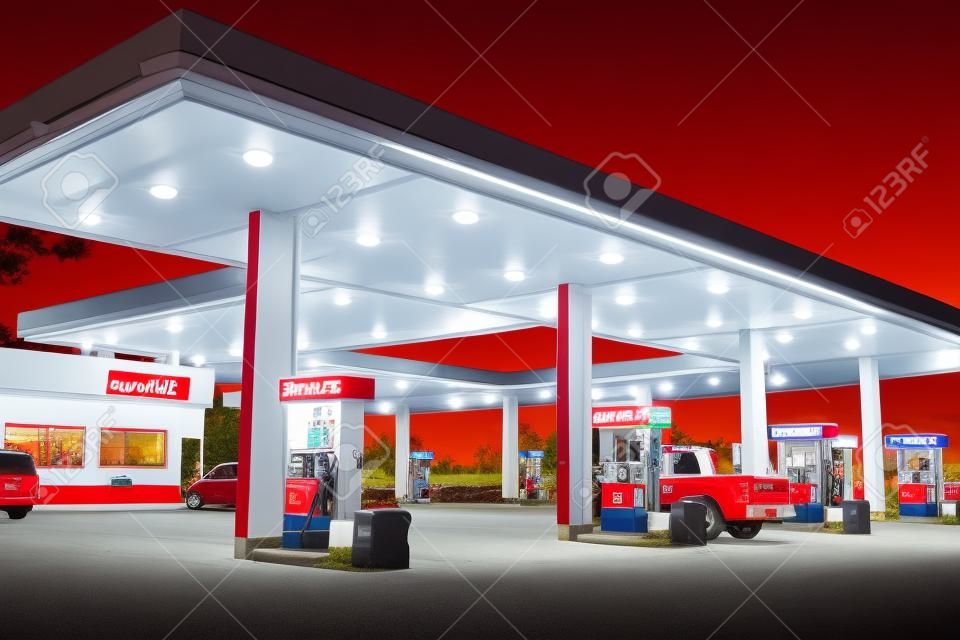 Retail Gasoline Station and Convenience Store/Early evening time exposure of modern retail gasoline station. All identifying logos and trademarks have been removed, and station?s original color scheme has been replaced