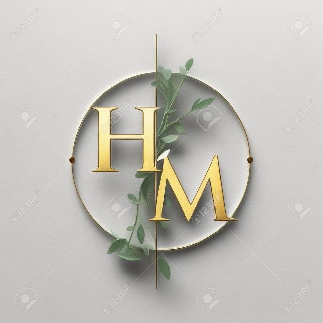 Początkowe logo litery hm z ręcznie narysowanym kwiatowym, początkowym logo czcionki ślubnej z kółkiem i kwiatami.
