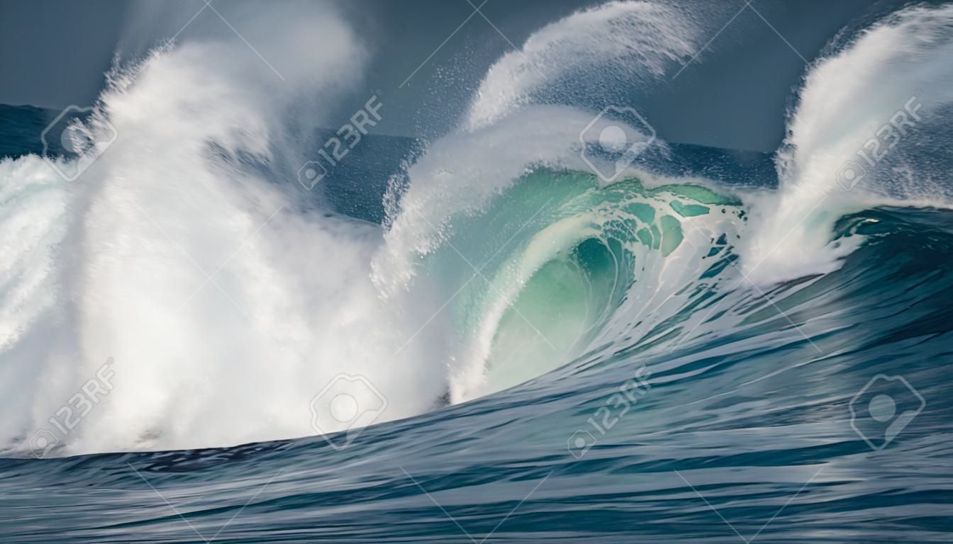 Huge waves crashing in ocean. Seascape environment background. Water texture with foam and splashes. Hawaiian surfing spots with nobody