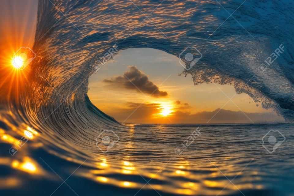 View of the sunset through the sea water wave