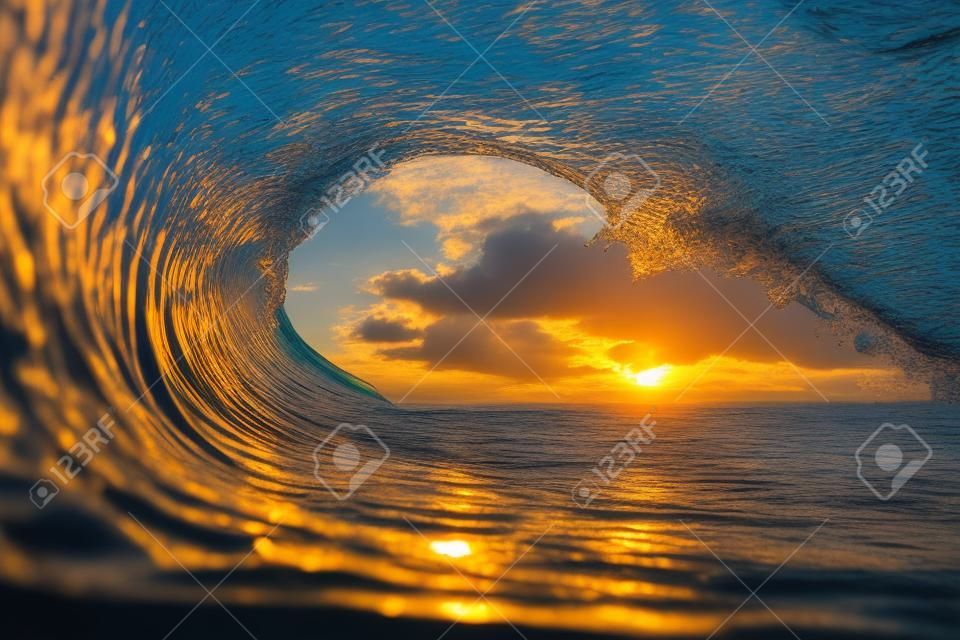 View of the sunset through the sea water wave