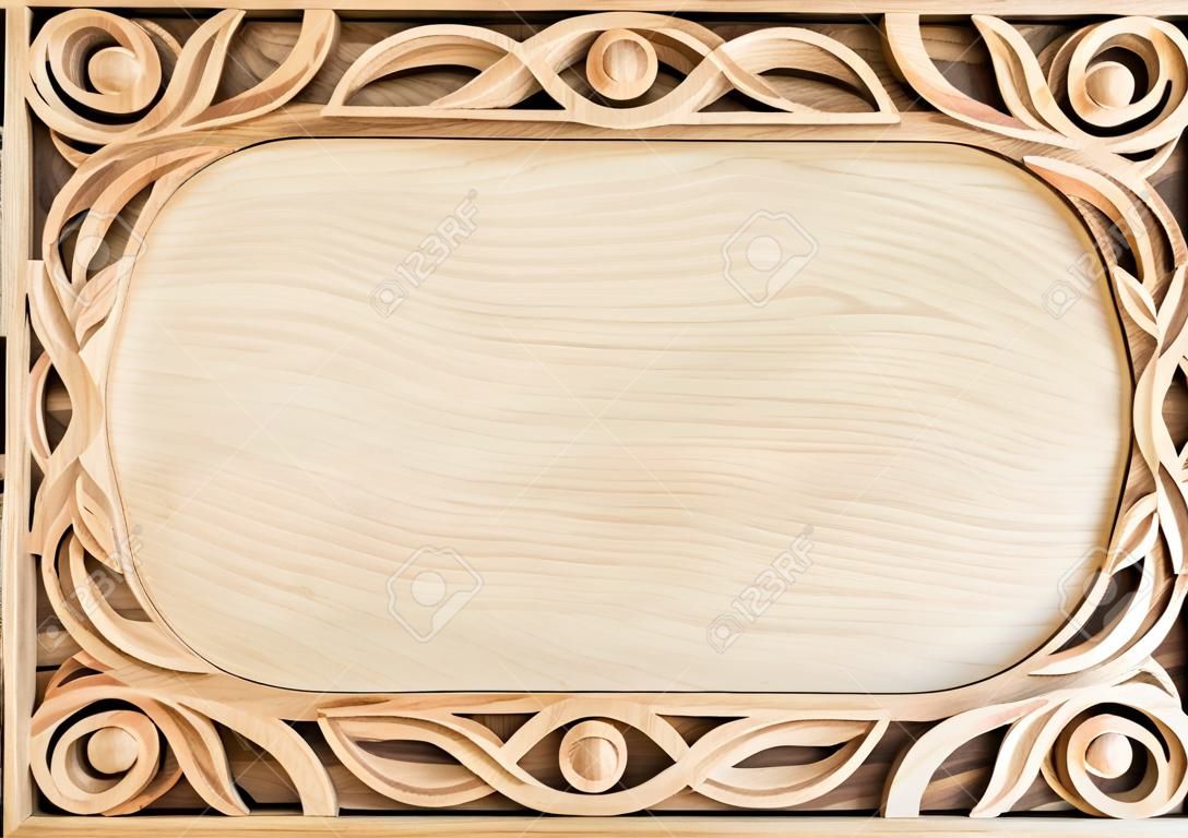 Pattern of flower carved frame on wood background