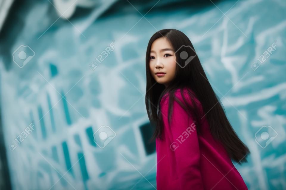 Portrait of young pretty hipster asian woman