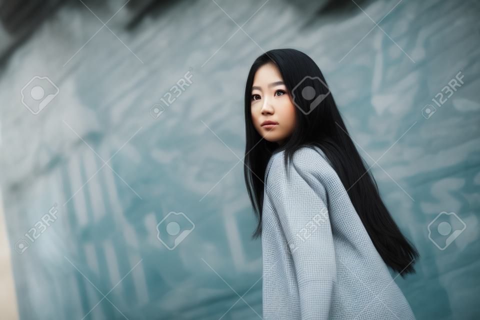 Portrait of young pretty hipster asian woman