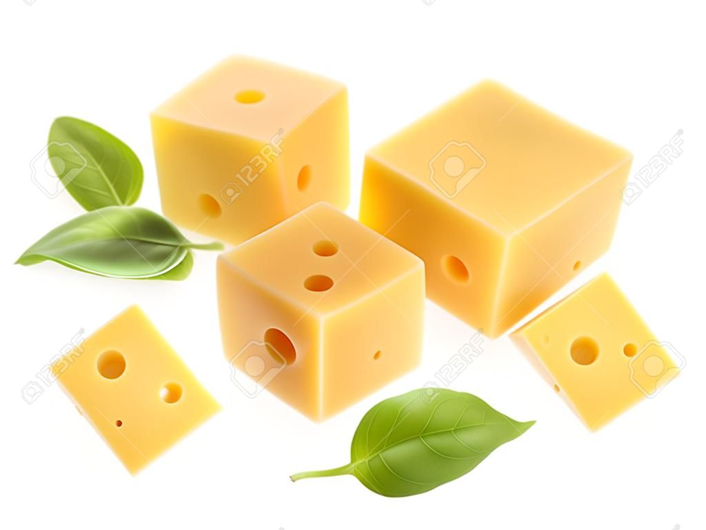 Cubes of cheese with basil leaves isolated on white