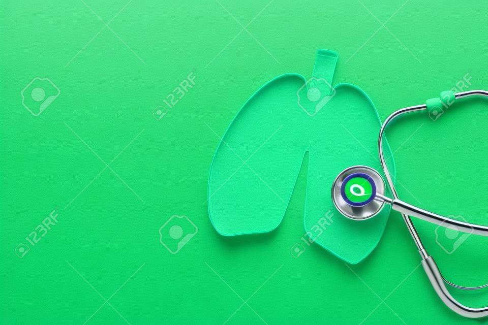Lung health therapy medical concept . silhouette of the lungs and a stethoscope on a green background. concept of respiratory disease, pneumonia, tuberculosis, bronchitis, asthma