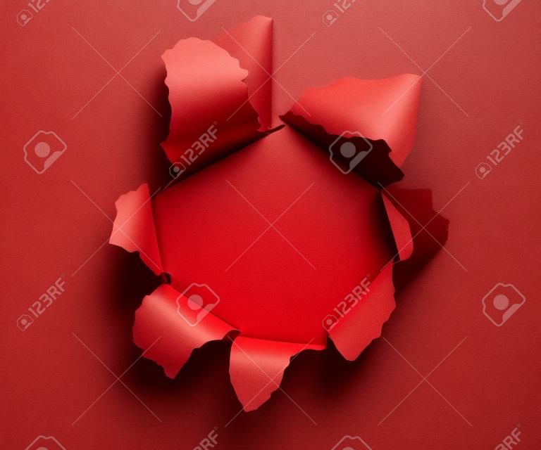 Hole in a red paper