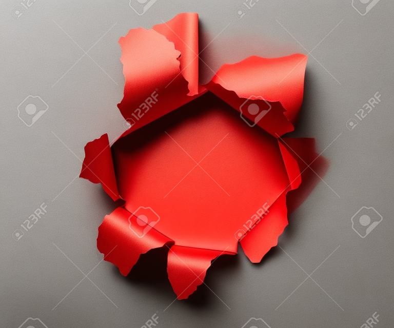Hole in a red paper