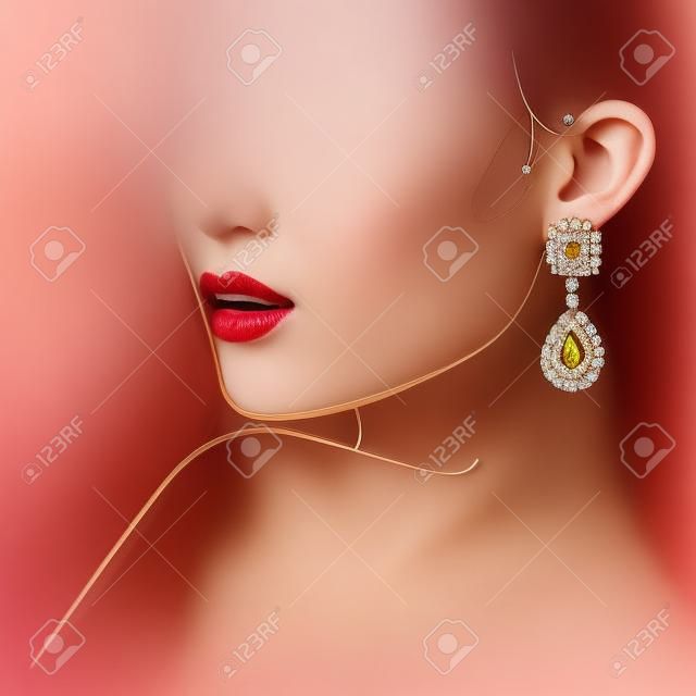 美麗的女人戴耳環。