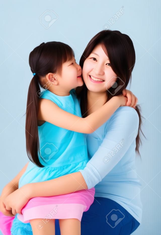 korean mother and her daughter with isolated background