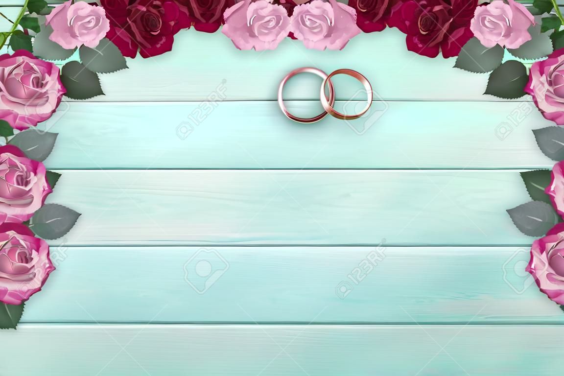 Draufsicht von rosa Rosen und Brautringen für Hochzeit auf Hintergrund des schäbigen hölzernen Hintergrunds und Platz für Ihren Text