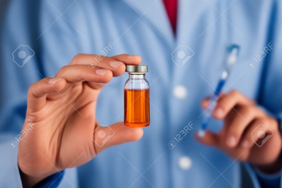 Doctor holding a vial