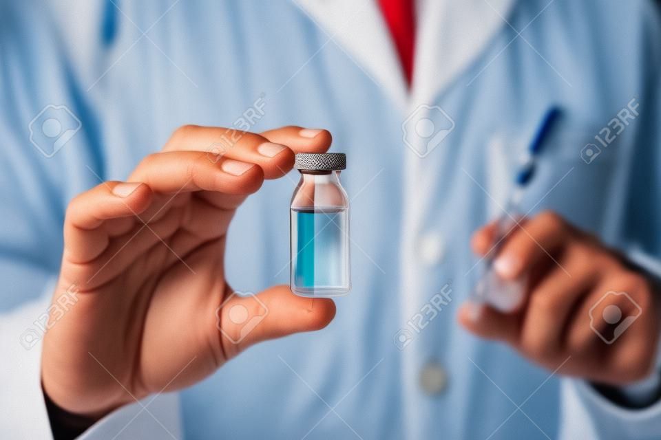 Doctor holding a vial