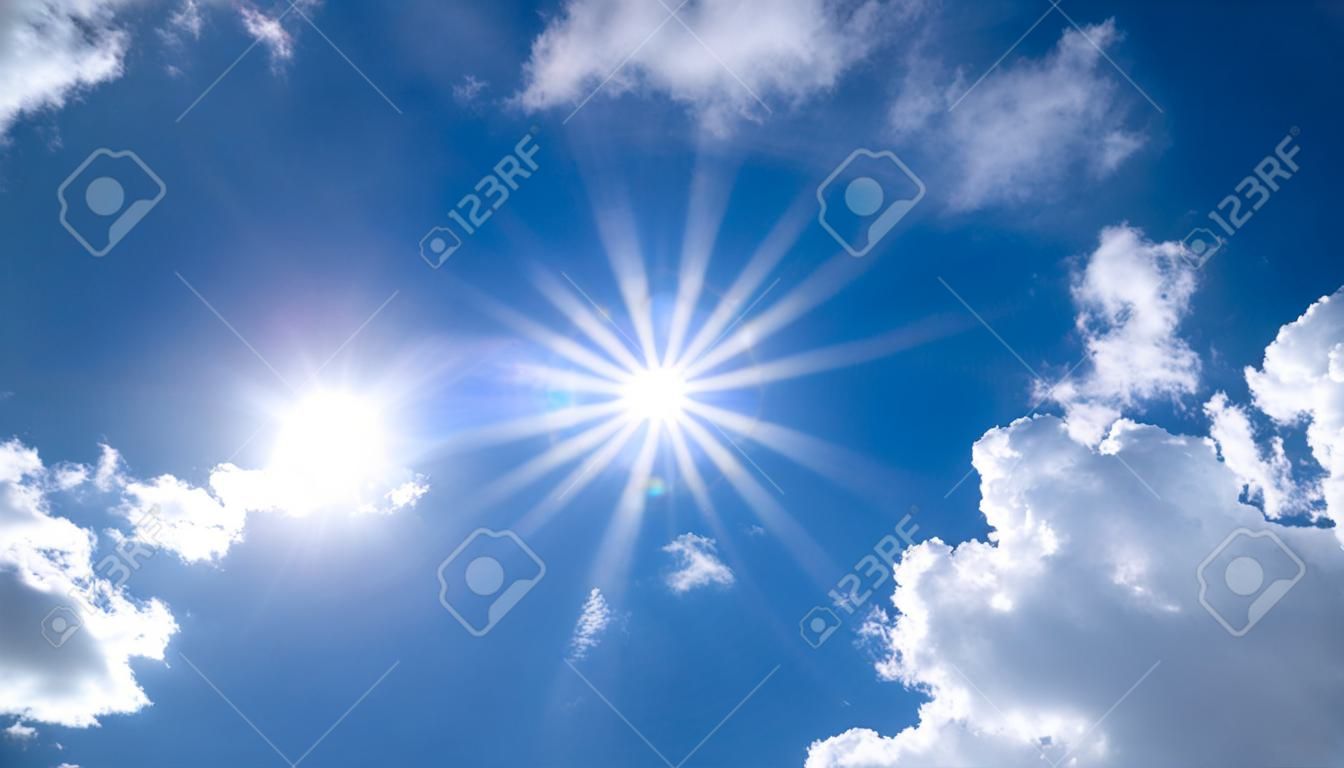 Aerial view of beautiful sky with clouds and sun on a summer day. Time lapse of clouds above the blue sky with the sun shining. Sky nature background.