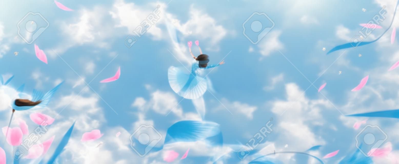 Una niña volando con alas en primavera.