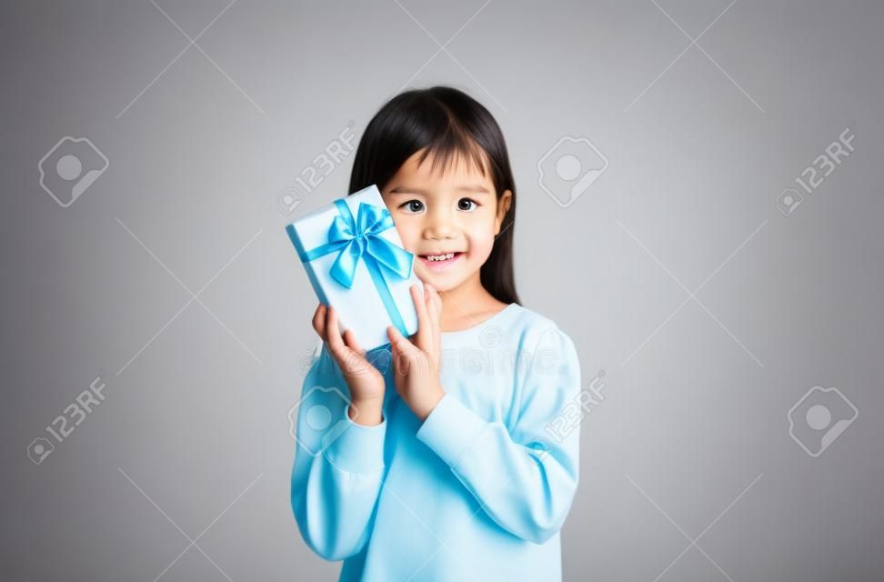 Asian little child girl with gift box on white background