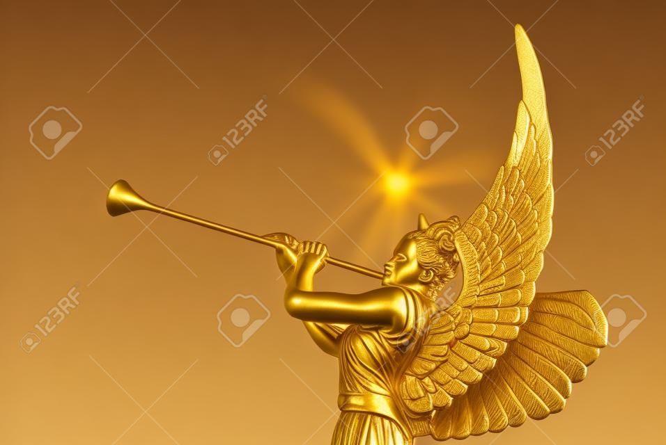 The statue of the angel with golden trumpet