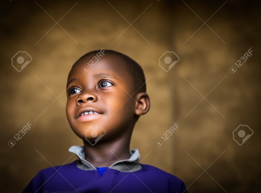 Close-up Portrait of African Boy portrait inside of school classroom. High quality photo