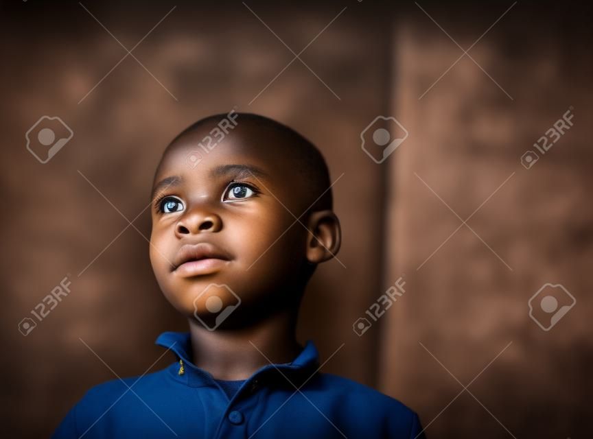 Close-up Portrait of African Boy portrait inside of school classroom. High quality photo
